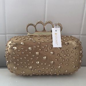 Knuckle studded clutch gold tone New With Tags
